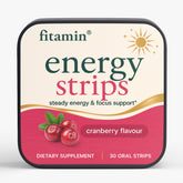 A square tin of fitamin Energy Strips cranberry flavour dietary supplement, featuring a cream and pink label with a sun graphic and cranberry illustration, on a light gray background.