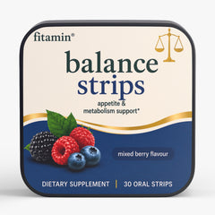 A square tin of fitamin Balance Strips dietary supplement in mixed berry flavour, featuring a cream and navy blue label with illustrations of berries and a gold scale icon.